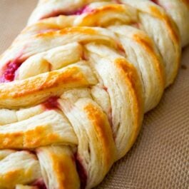 close-up photo of a pastry braid with raspberry filling