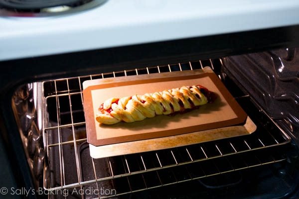 raspberry danish pastry braid baking in oven
