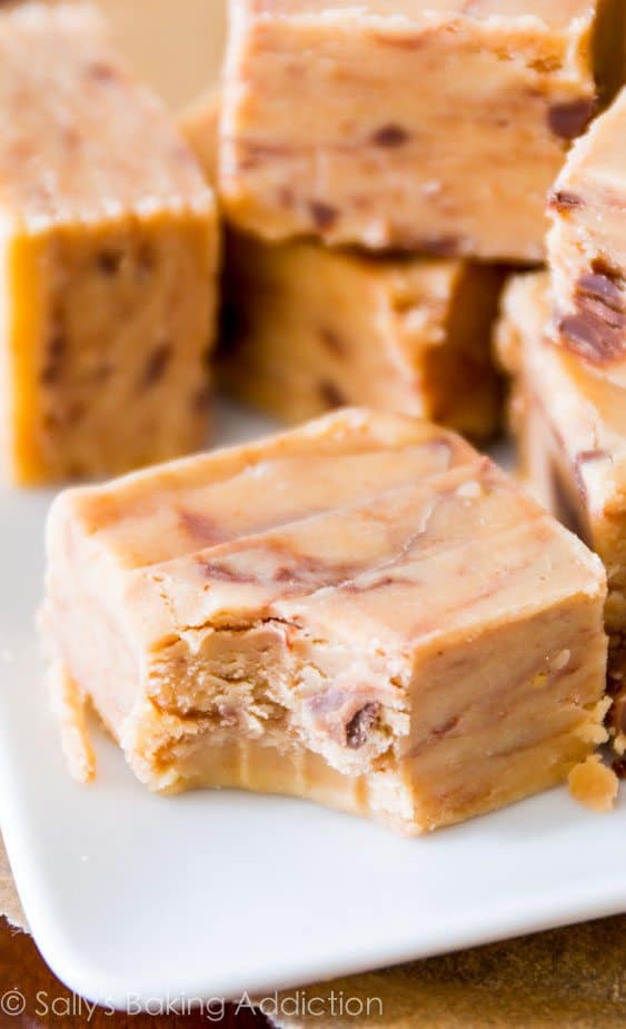 squares of peanut butter fudge with a bite taken out of one piece
