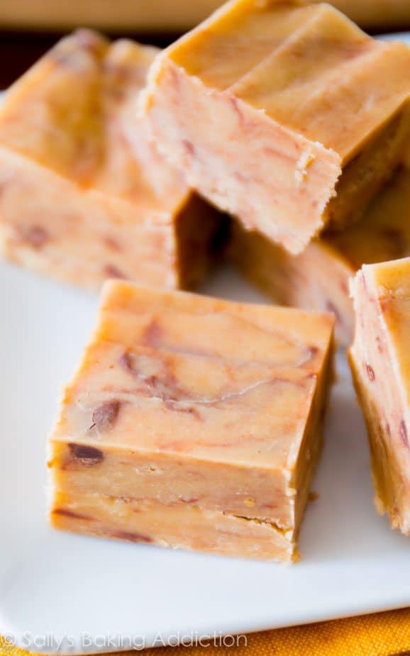 squares of peanut butter fudge on a white plate