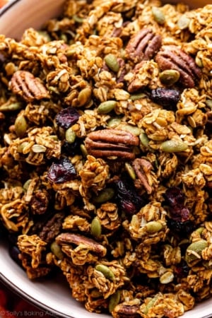 close-up photo of pumpkin spice granola with pecans and dried cranberries.