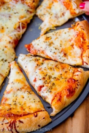sliced cheese pizza on a pizza pan
