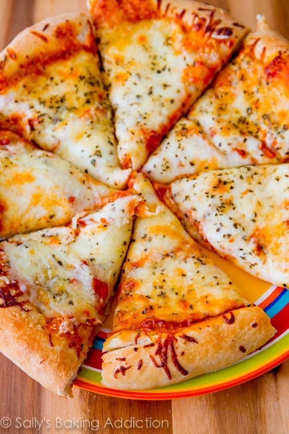 sliced cheese pizza on a colorful plate