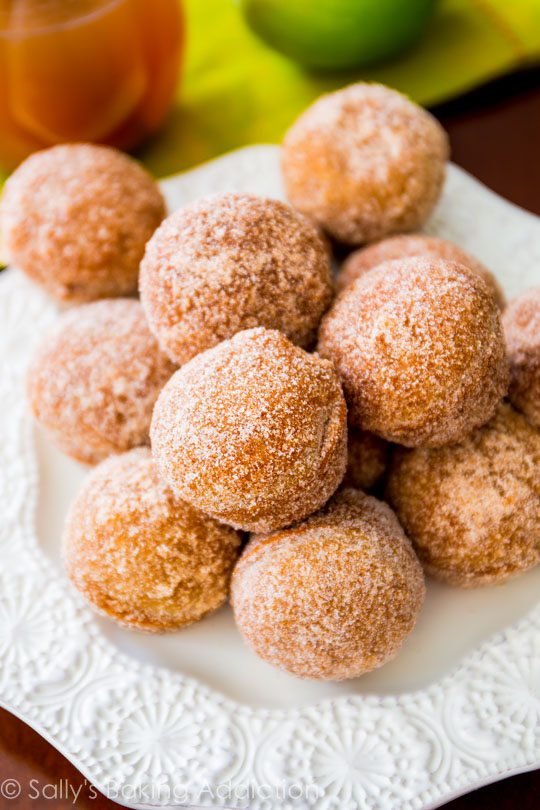 apple cider donut holes on a white plate
