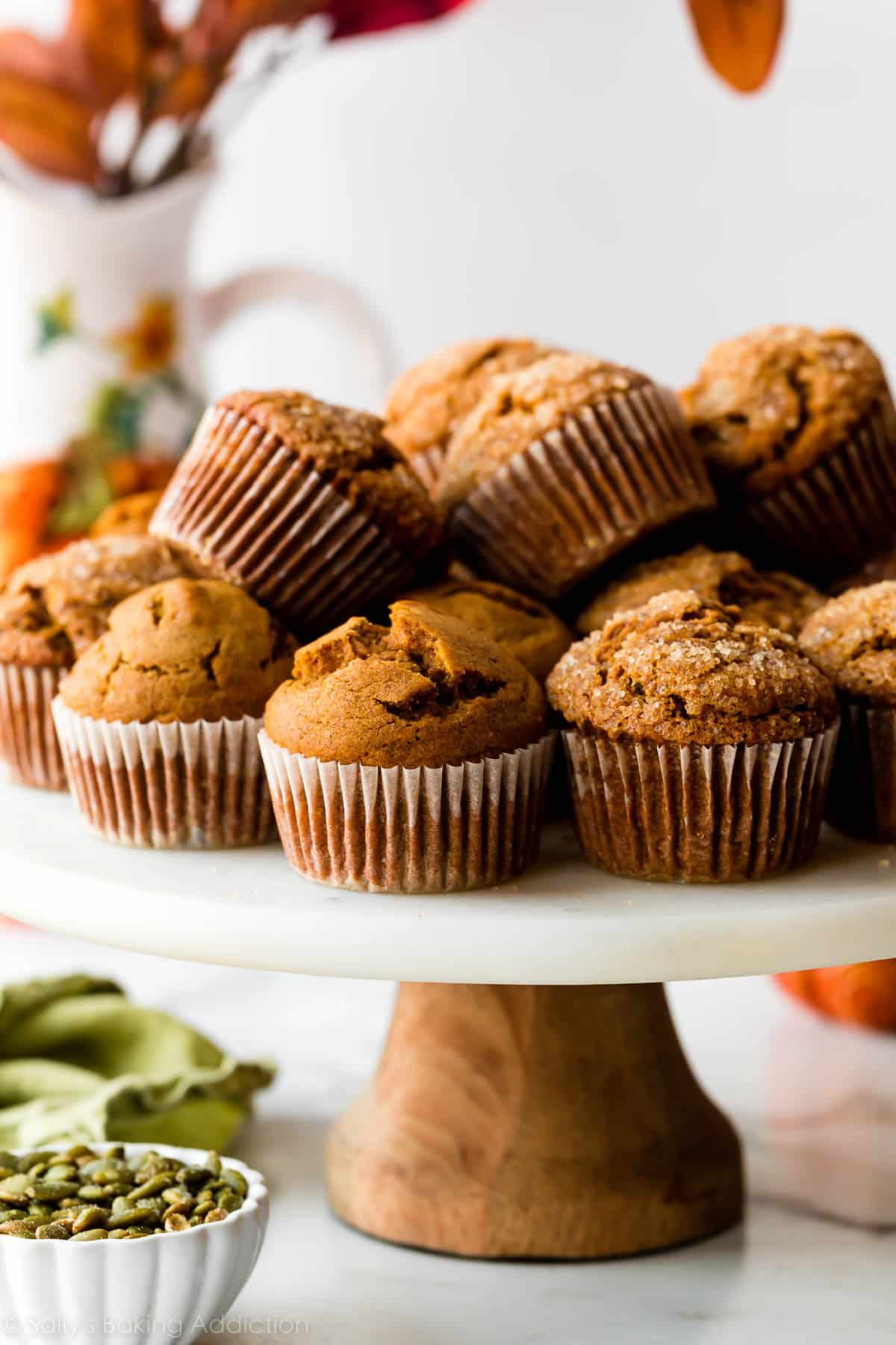 pumpkin muffins on marble cake stand.