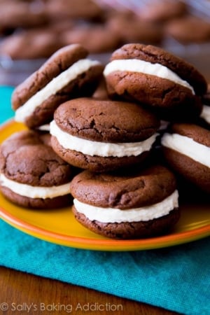 homemade Oreo cookies piled on a yellow plate