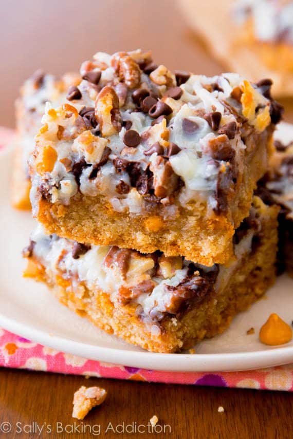 stack of ultimate magic cookie bars on a white plate