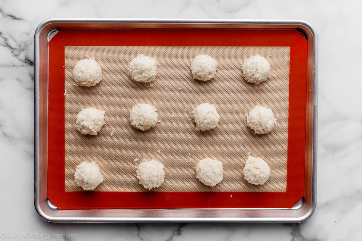 coconut macaroons scooped onto Silpat-lined baking sheet.