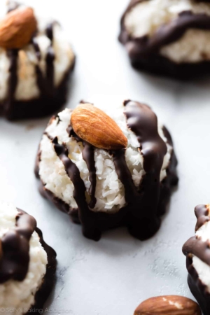 Coconut macaroons drizzled with dark chocolate and topped with an almond