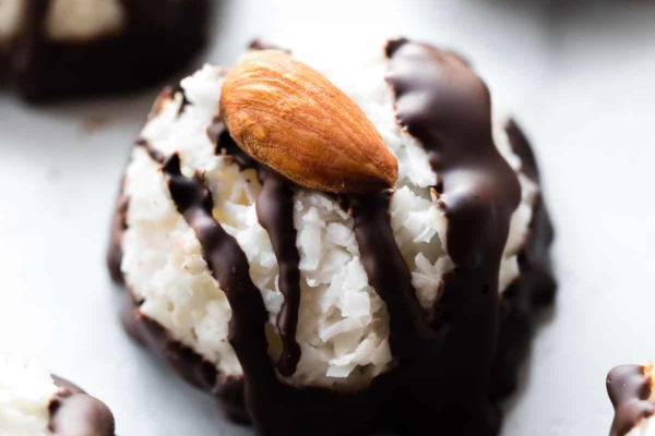 Coconut macaroons drizzled with dark chocolate and topped with an almond