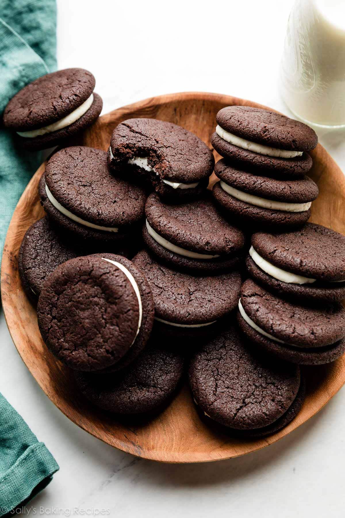 homemade Oreos on wooden plate.