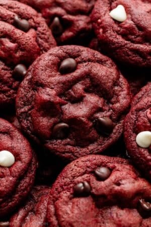 close-up of red velvet chocolate chip and white chocolate chip cookies.