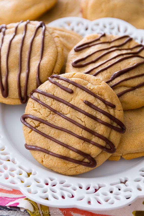 Reese's stuffed peanut butter cookies with peanut butter chocolate drizzle on a white plate