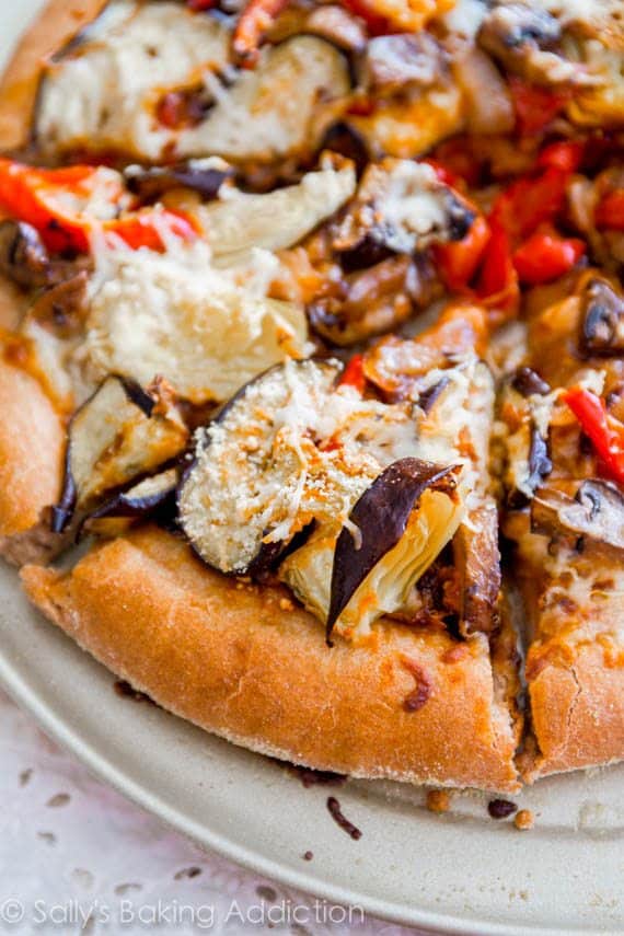 Homemade Whole Wheat Pizza Crust (that actually tastes good!) piled high with roasted veggies. Pizza night just got a little healthier.