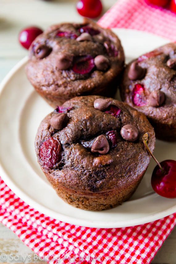 chocolate cherry muffins on a white plate