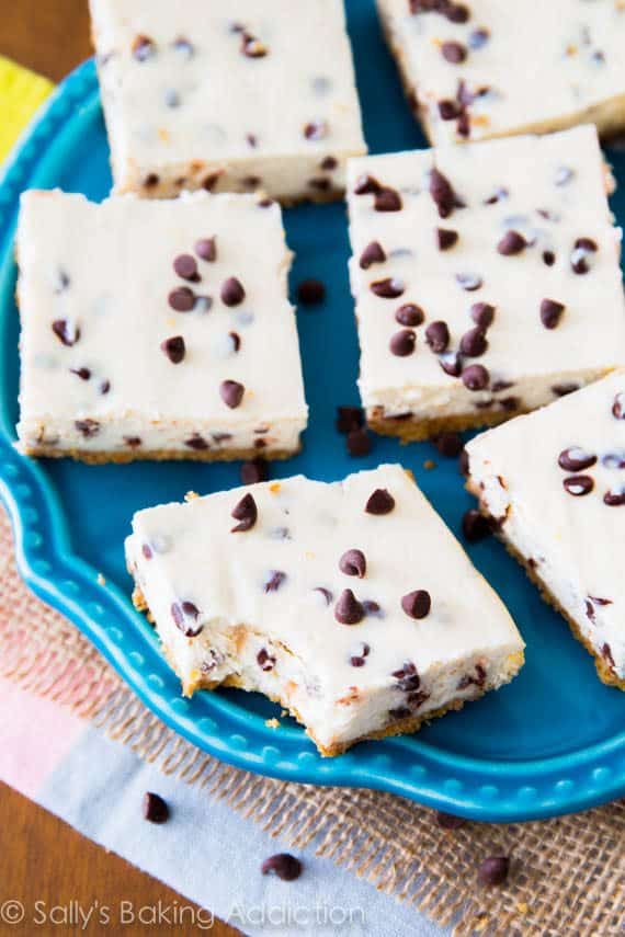 chocolate chip cheesecake bars on a blue plate