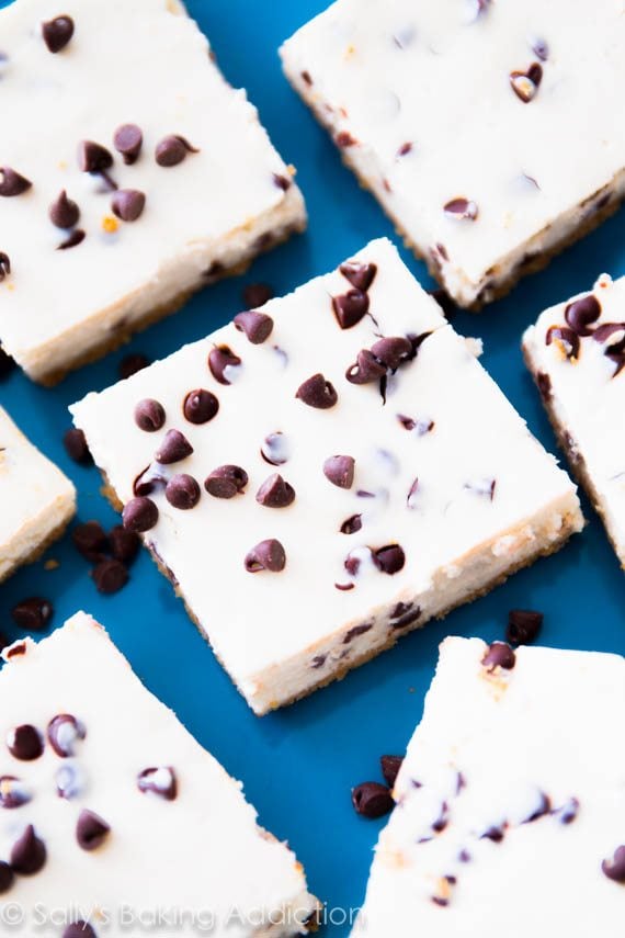 chocolate chip cheesecake bars on a blue plate