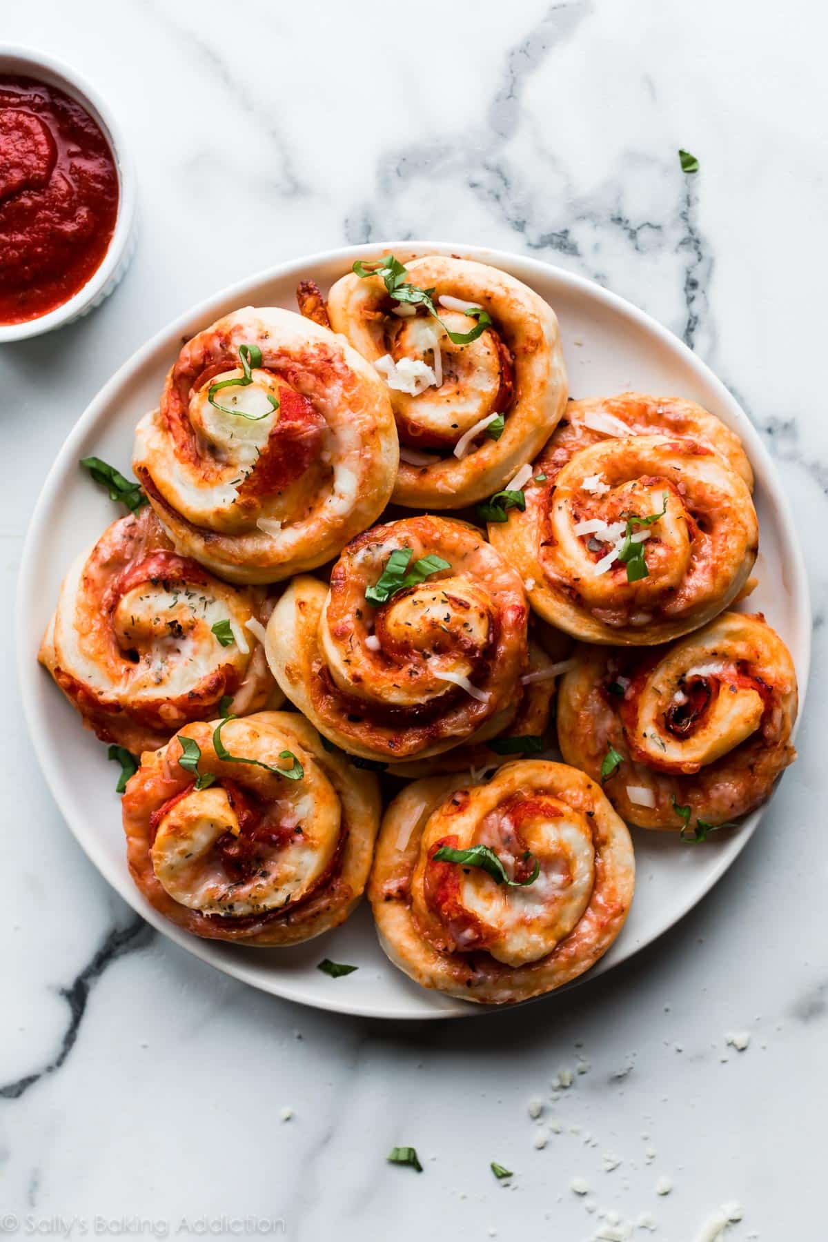 Pepperoni pizza rolls on a white plate