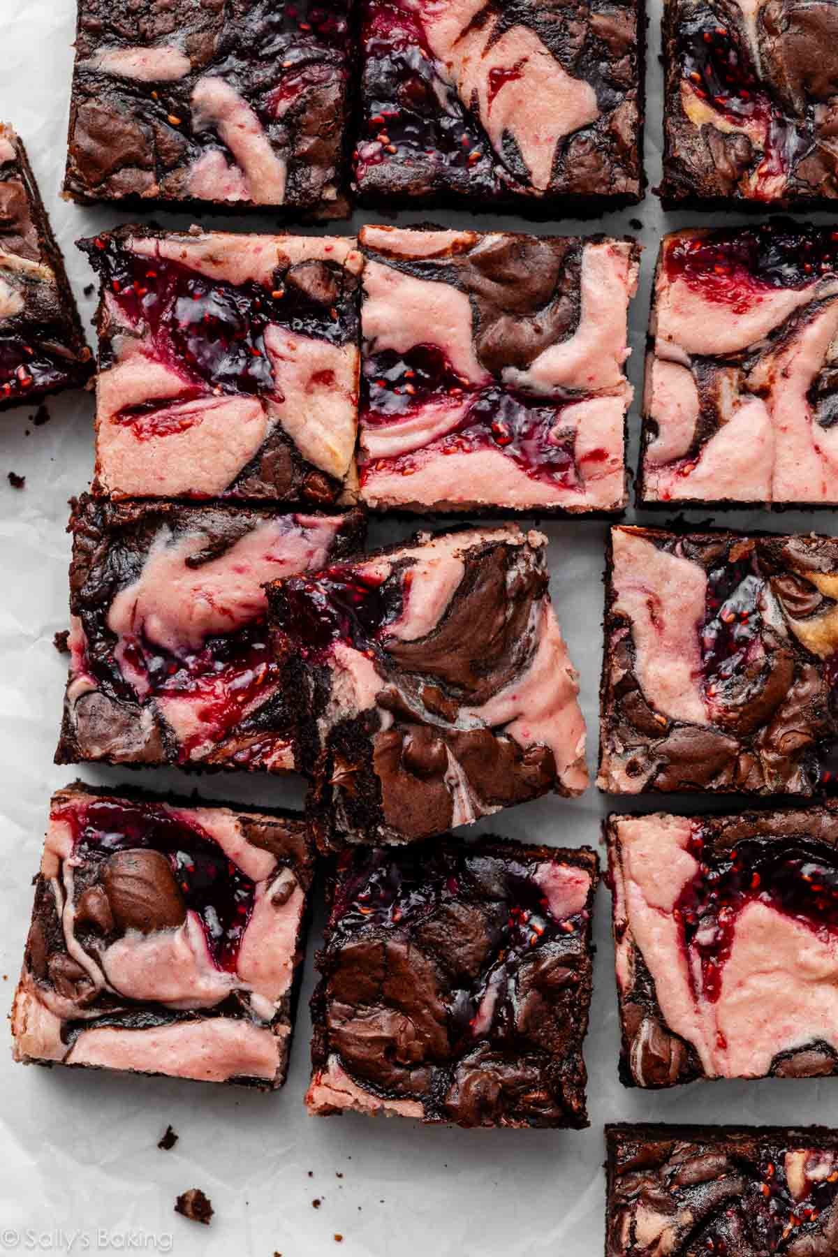 raspberry cheesecake brownies cut into squares.