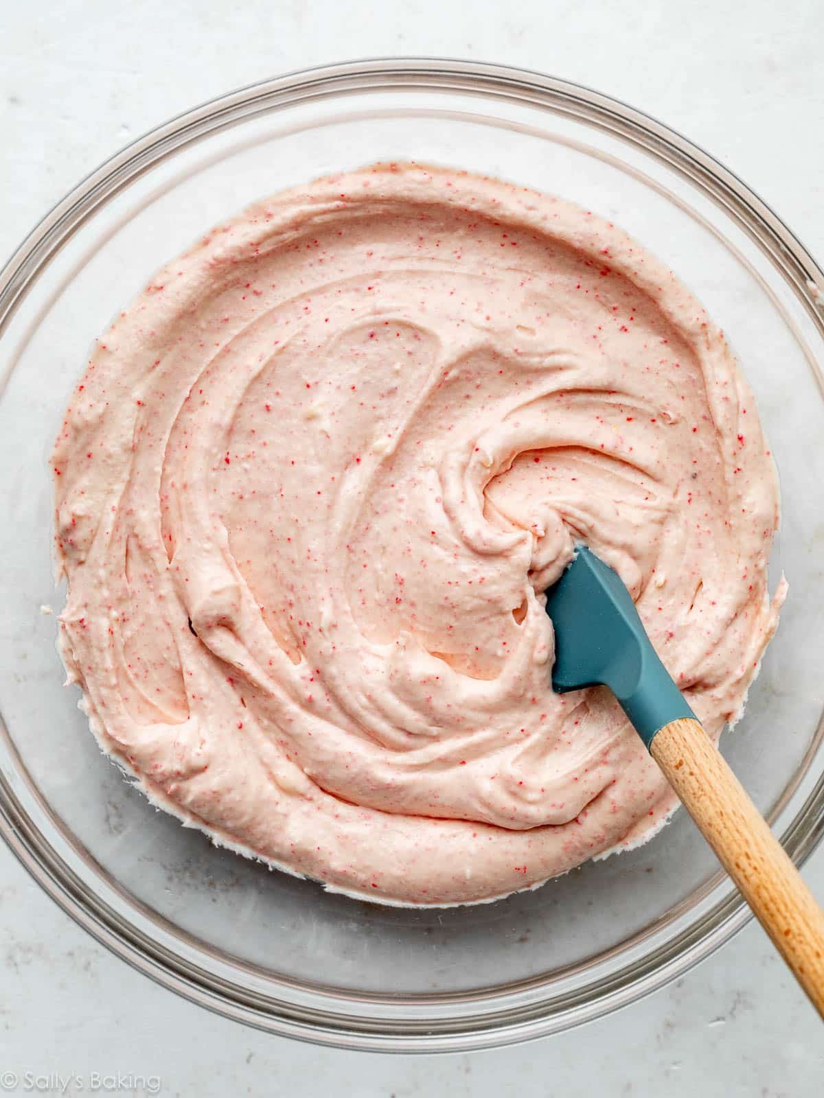 pink batter in glass bowl.