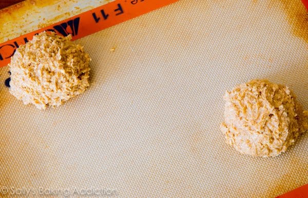 oatmeal cookie dough mounds on a silpat baking mat