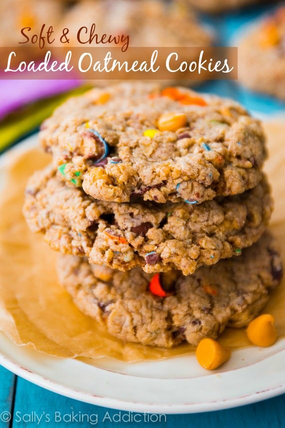 stack of loaded oatmeal cookies on a white plate