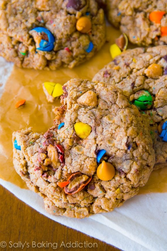 loaded oatmeal cookies with a bite taken from one
