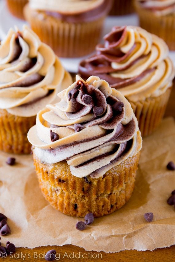 banana chocolate chip cupcakes topped with chocolate peanut butter swirl fr...