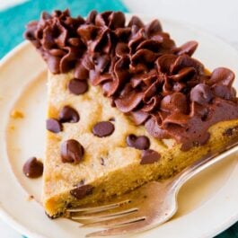 slice of chocolate chip cookie cake on a white plate