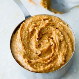 honey roasted peanut butter in a measuring cup