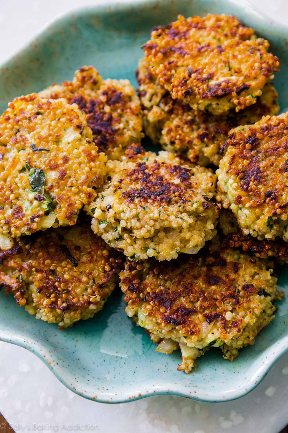 quinoa patties on a teal plate