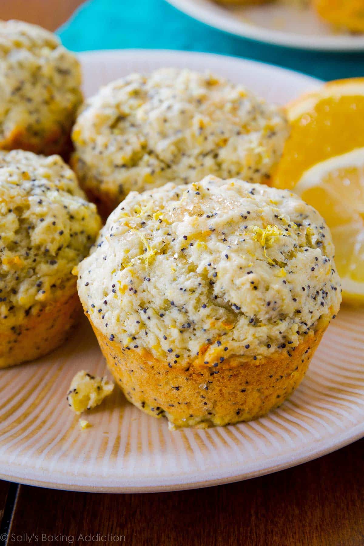 orange lemon poppy seed muffins on a plate
