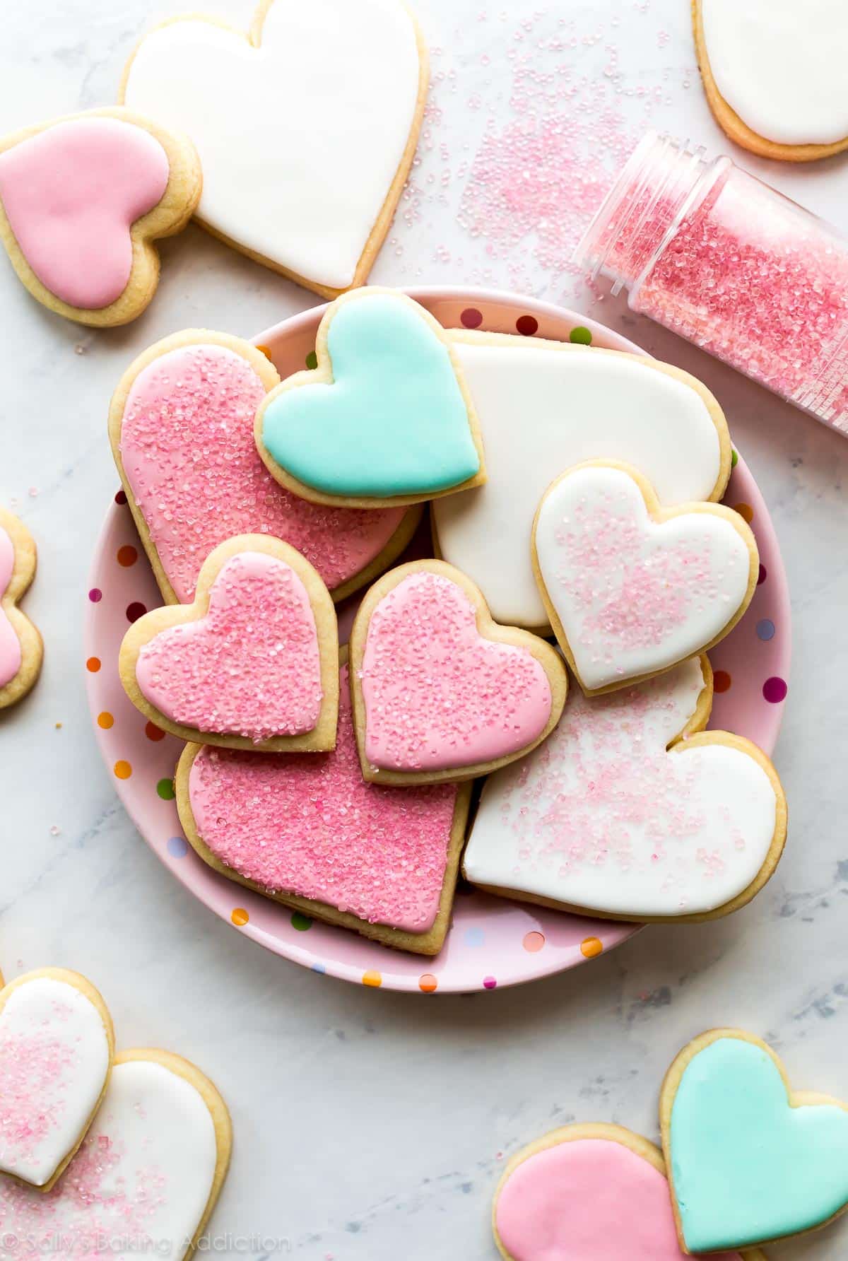 soft cut-out sugar cookies on a pink plate