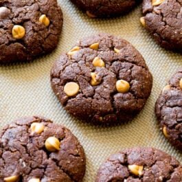 flourless peanut butter brownie cookies on a silpat baking mat