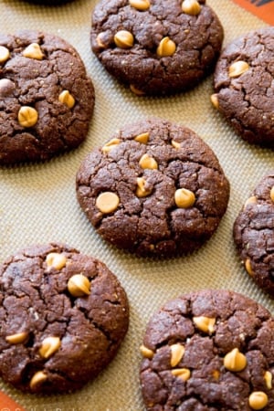 flourless peanut butter brownie cookies on a silpat baking mat