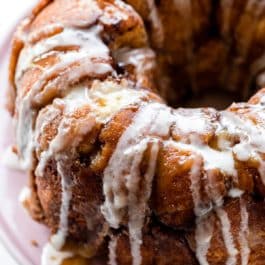 monkey bread with icing on pink cake stand