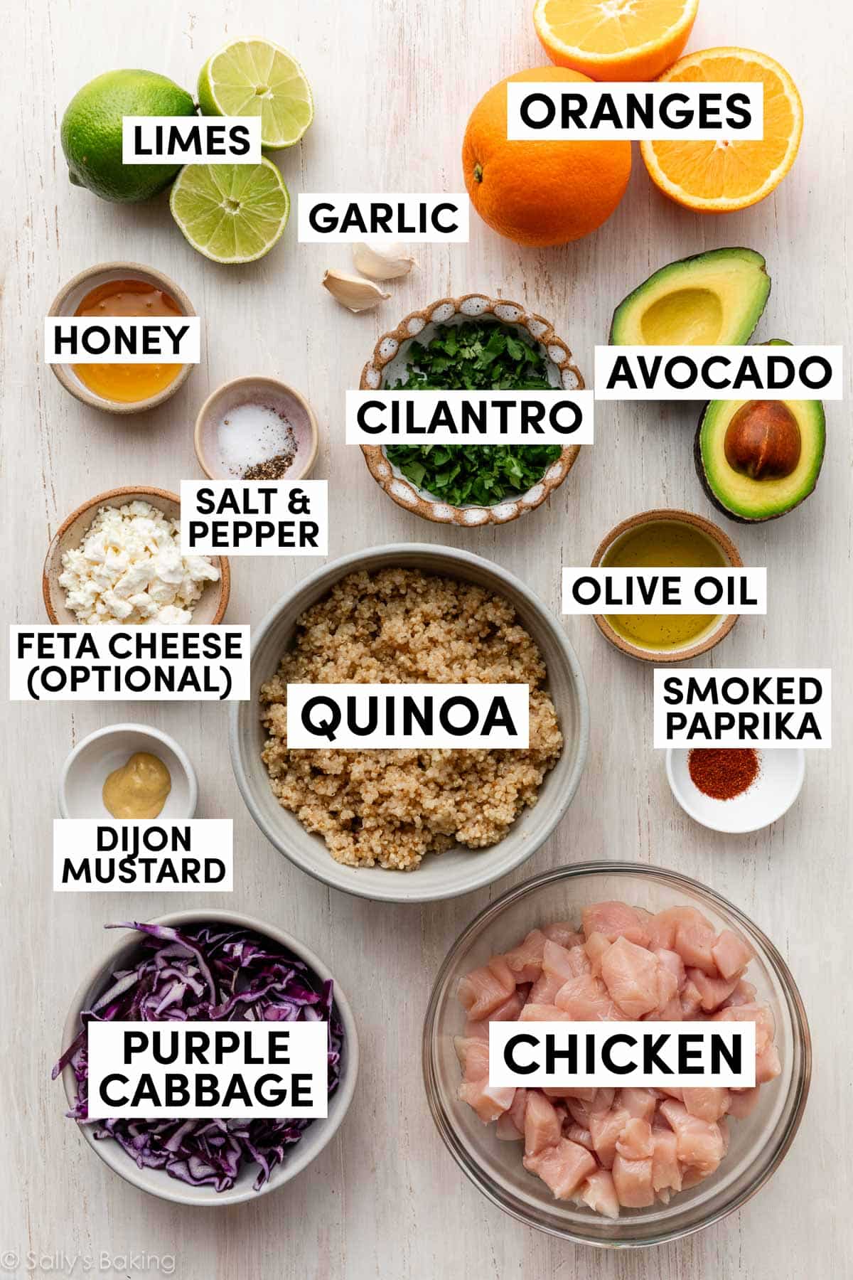 ingredients in bowls including cabbage, chicken, feta cheese, and honey.