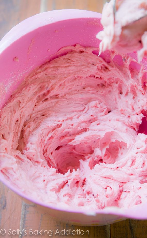 raspberry frosting in a pink bowl