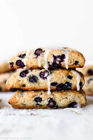 stack of blueberry scones with vanilla icing