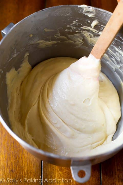 yellow cupcake batter in a bowl with a spatula