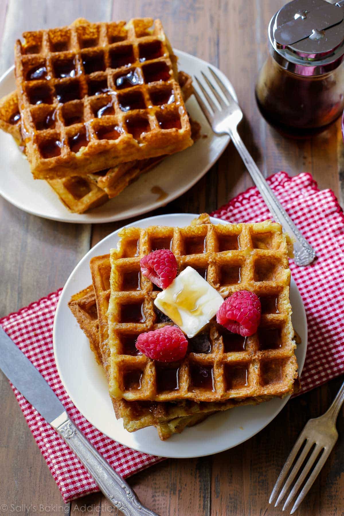 stacks of buttermilk waffles on white plates