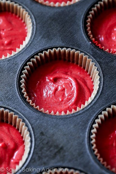 red velvet cupcake batter in a cupcake pan before baking