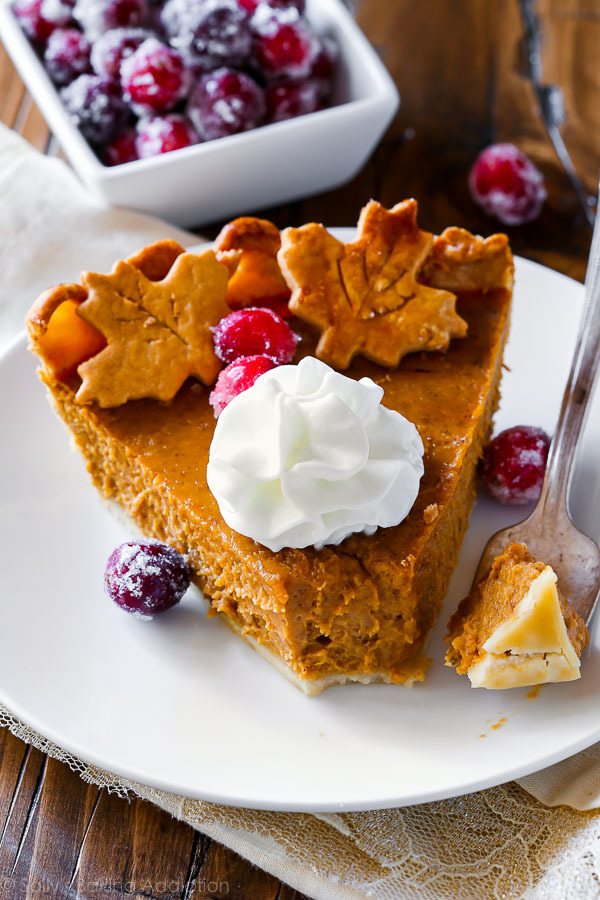 slice of pumpkin pie with whipped cream