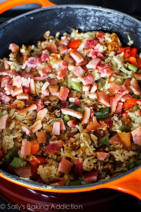 hash browns, peppers, and bacon in a skillet