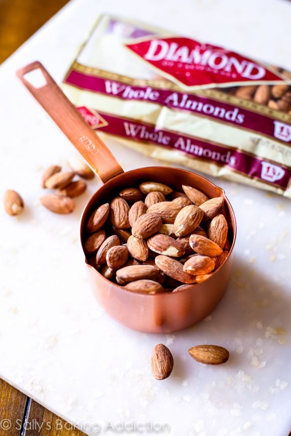 almonds in a copper measuring cup