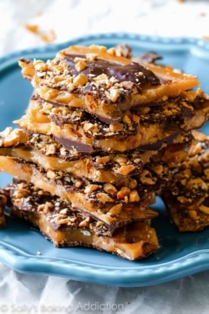 stack of salted dark chocolate almond toffee on a blue plate