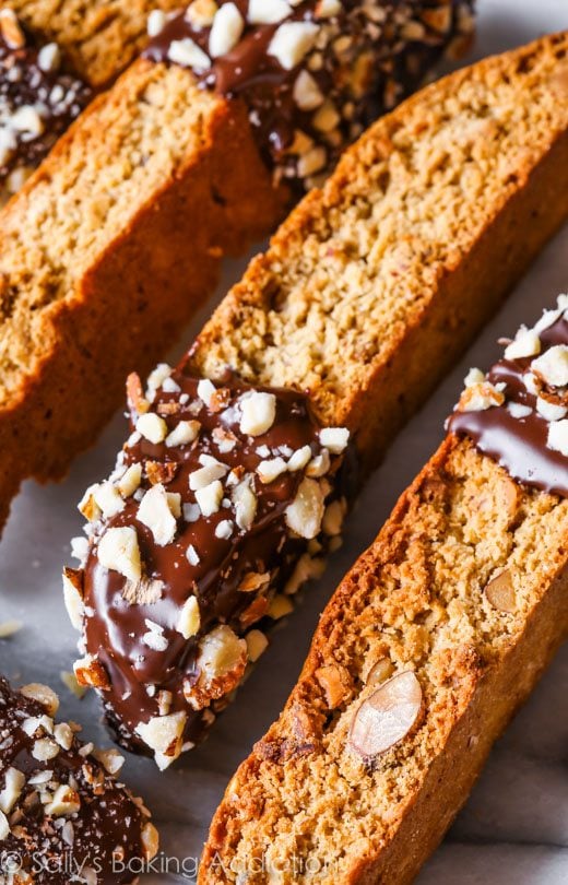 almond biscotti with part of each cookie dipped in chocolate