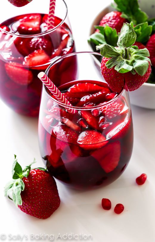 strawberry pomegranate sangria in glasses with straws