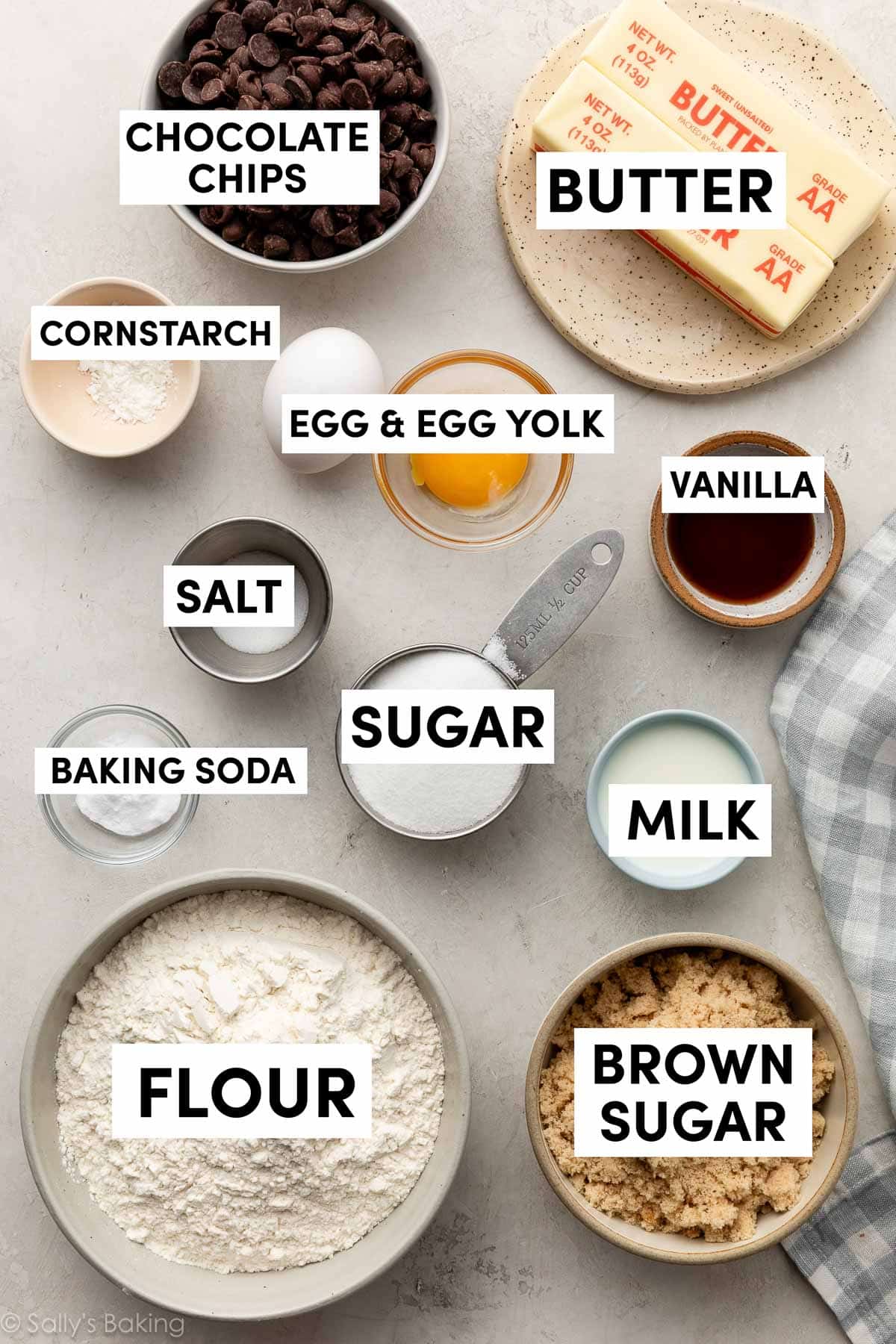 ingredients in bowls including sugar, brown sugar, butter, flour, baking soda, and vanilla.