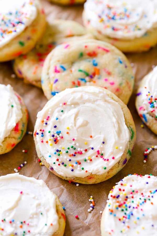 sprinkle sugar cookies topped with vanilla frosting and sprinkles